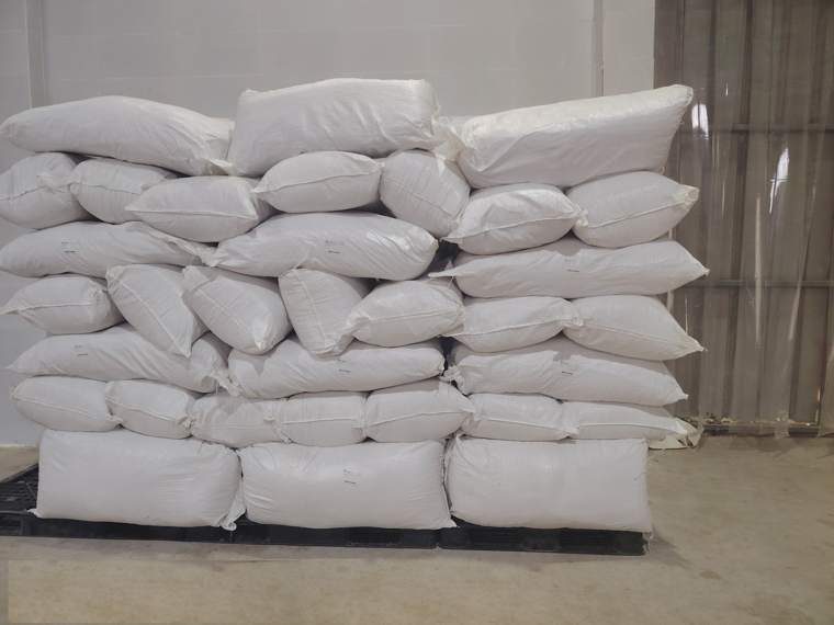 Bagged El Yasmina product stacked on a pallet in the warehouse, prepared for dispatch